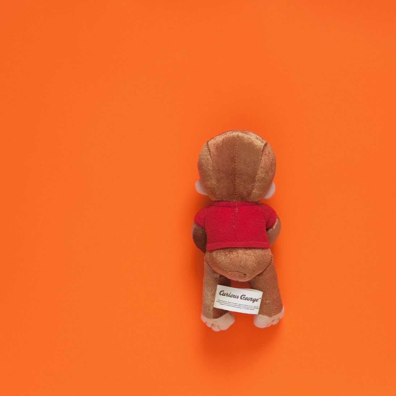 Tom Kiefer, a photographer in Arizona, spent 11 years (2003-2014) as a janitor at a Customs and Border Protection facility. He collected the items that agents confiscated from migrants and threw out, and he photographed them. "Curious George," shared with HuffPost, is part of his collection "El Sueño Americano - The American Dream" and can be found at http://tomkiefer.com and https://www.instagram.com/tomkiefer.photographer/.