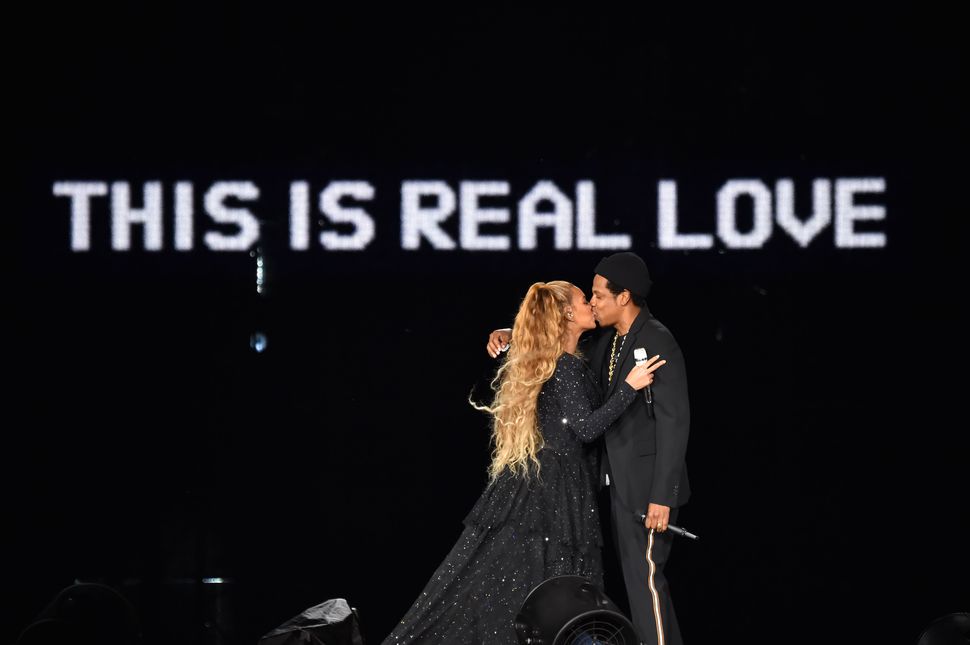 Beyoncé and Jay-Z kiss ending their performance onstage during the On the Run II Tour on June 9.