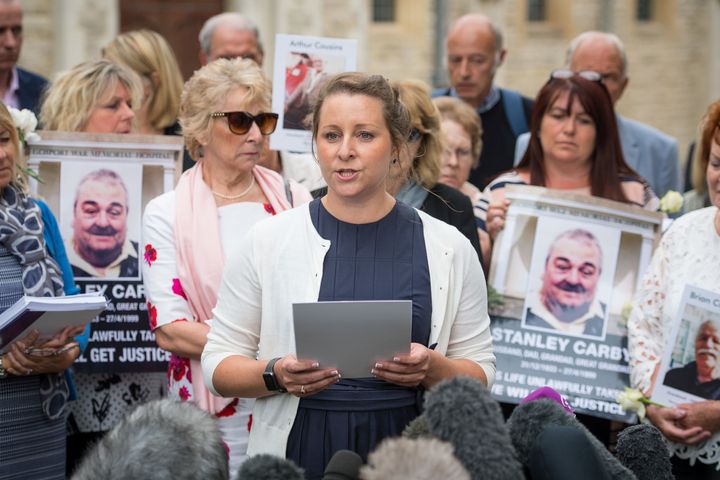 Bridget Reeves, pictured centre, spoke last year about how relatives had been denied 'their final words' at Gosport.