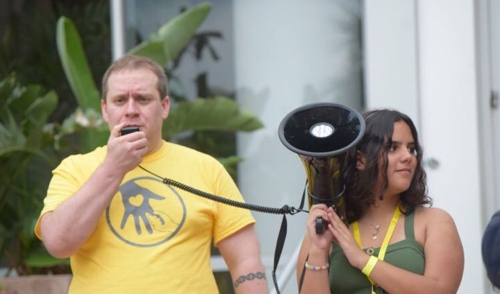 Jordon Dyrdahl-Roberts, left, participates in the Families Belong Together Rally in Orlando, Florida, on Friday. The protest was a response to the U.S. government separating children from their parents along the U.S.-Mexico border.