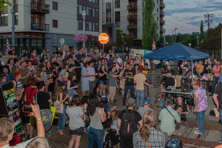 A loud cheer comes after the moments of silence at the end of the vigil at OccupyICEPDX, just in front of the ICE Portland Headquarters in SW Macadam on June 19, 2018, in Portland, Oregon.