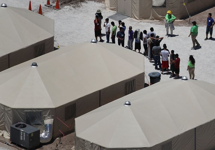 Children and workers are seen on Tuesday at a tent encampment recently built in Tornillo, Texas, to house immigrant children separated from their parents.