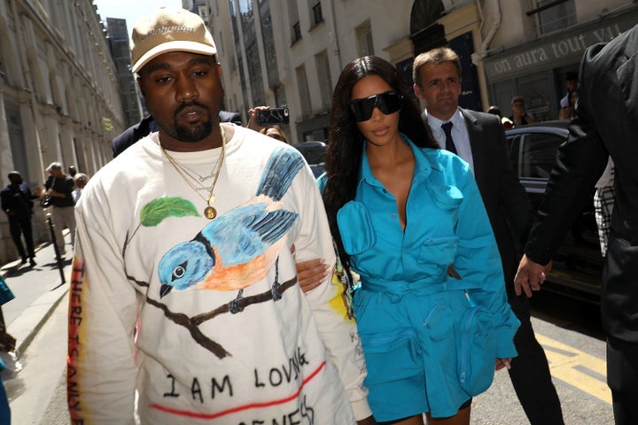 Kim Kardashian and Kanye West arrive at the Louis Vuitton Menswear Spring/Summer 2019 show on Thursday.