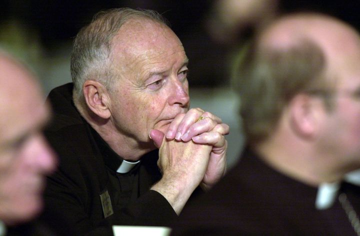 Cardinal Theodore McCarrick listens to a victim of clerical sexual abuse offer testimony during a meeting of U.S. Conference of Catholic Bishops on June 13, 2002, in Dallas, Texas.