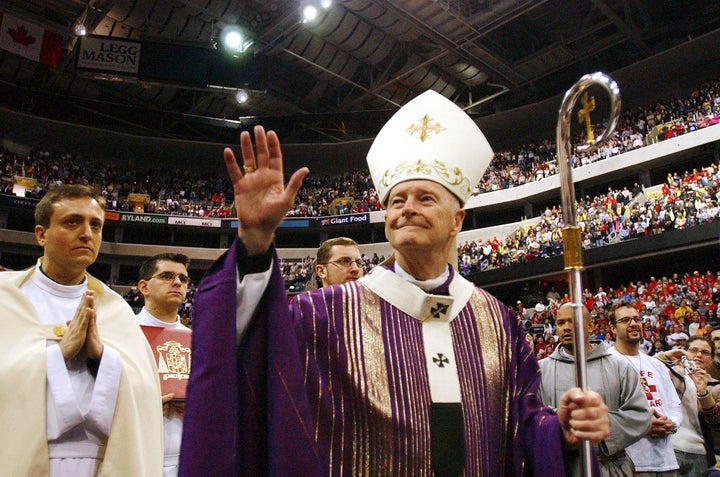 Cardinal Theodore McCarrick waves as he attends a Youth Mass for Life held at the MCI Center in Washington, D.C., January 22, 2004. 