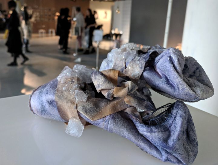 Sweat crystals grow on a pair of ballet shoes, as part of a collection by Alice Potts that imagines a future where accessories are grown from our bodily excretions.