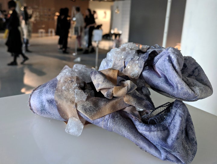 Sweat crystals grow on a pair of ballet shoes, as part of a collection by Alice Potts that imagines a future where accessories are grown from our bodily excretions.