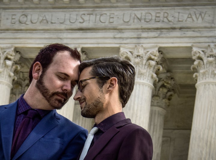 Plaintiffs Charlie Craig and David Mullins stand in front of the Supreme Court after the justices heard arguments in Masterpiece Cakeshop v. Colorado Civil Rights Commission on Dec. 5, 2017.