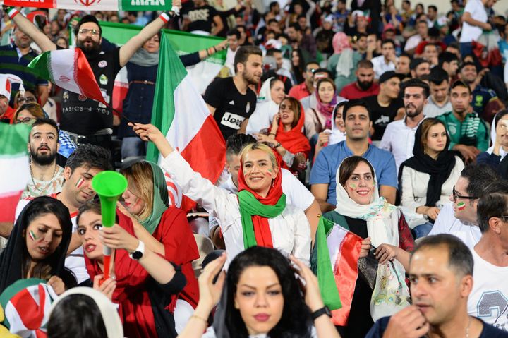 Women are seen attending a public World Cup viewing event inside Tehran's Azadi Stadium on Wednesday. It was the first time in nearly 40 years that women were allowed inside.