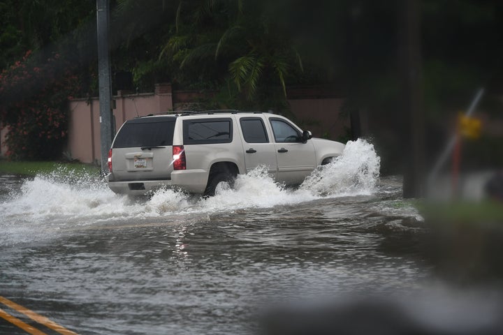 The motorcade of U.S. First Lady Melania Trump moves through a downpour en route from McAllen Miller International Airport to