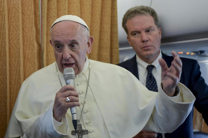 Pope Francis talks with journalists aboard a plane, at the end of his visit to Geneva on June 21 for the 70th anniversary of the World Council of Churches.