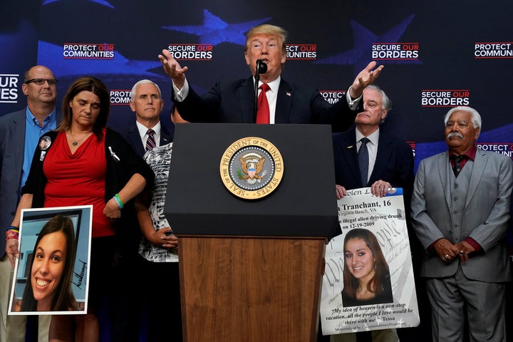 President Donald Trump introduces the parents of children killed by undocumented immigrants, in Washington, June 22.