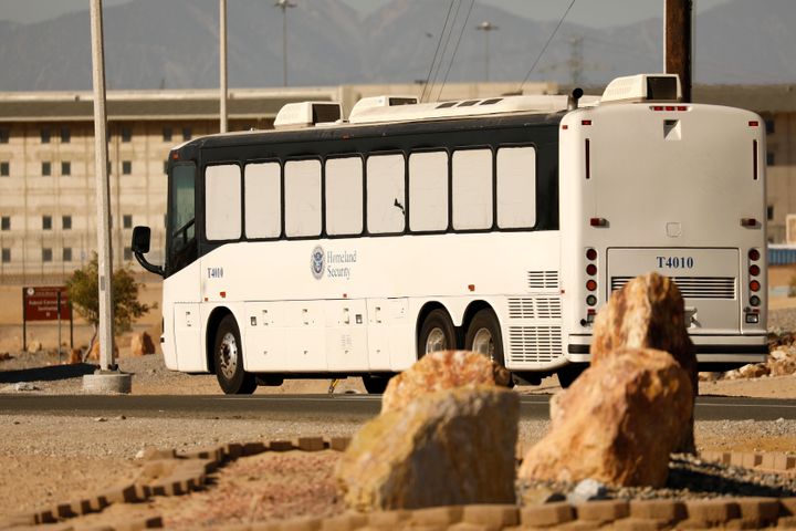 Immigration and Customs Enforcement detainees arrive at the federal prison complex in Victorville, California, on June 8.