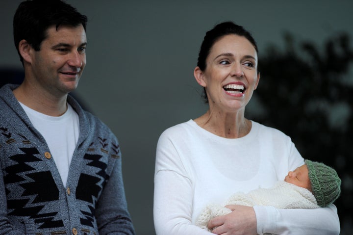 New Zealand Prime Minister Jacinda Ardern carries her newborn baby Neve Te Aroha Ardern Gayford with her partner Clarke Gayfor as she walks out of the Auckland Hospital in New Zealand, June 24, 2018.