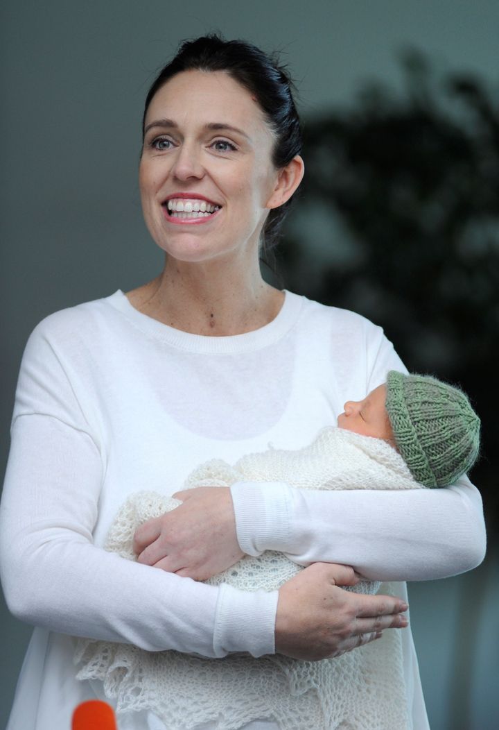 New Zealand Prime Minister Jacinda Ardern carries her newborn baby Neve Te Aroha Ardern Gayford with her partner Clarke Gayfor as she walks out of the Auckland Hospital in New Zealand, June 24.