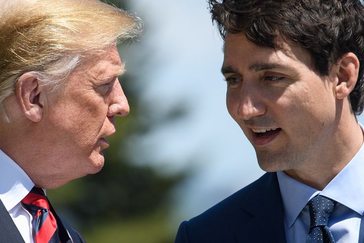 President Donald Trump speaks with Canadian Prime Minister Justin Trudeau at the G-7 summit in Quebec on June 8.
