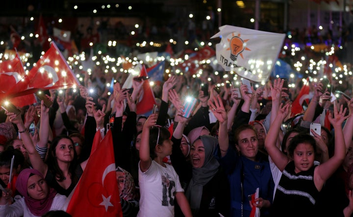 AK Party supporters celebrate in front of the AKP headquarters in Ankara, Turkey.