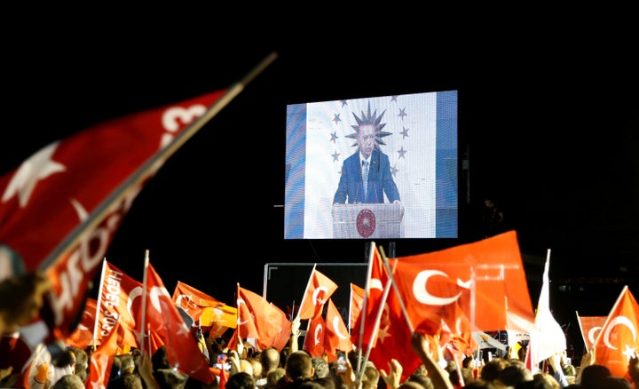 Turkish President Tayyip Erdogan is seen on the screen as he addresses his supporters in Istanbul, Turkey.