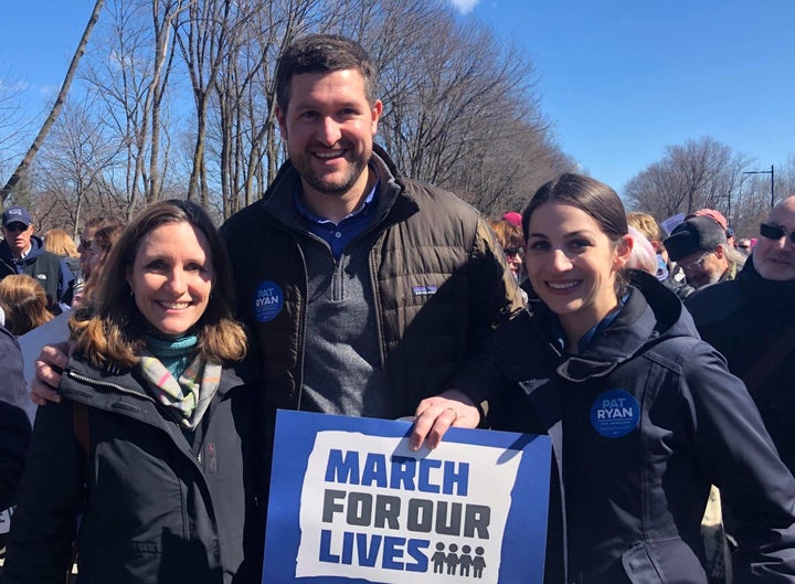 Democrat Pat Ryan, center, stands with his wife, Rebecca, right, and another attendee of a March for Our Lives rally in New Y