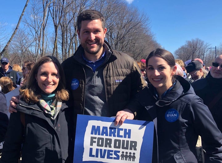 Democrat Pat Ryan, center, stands with his wife, Rebecca, right, and another attendee of a March for Our Lives rally in New York's 19th.