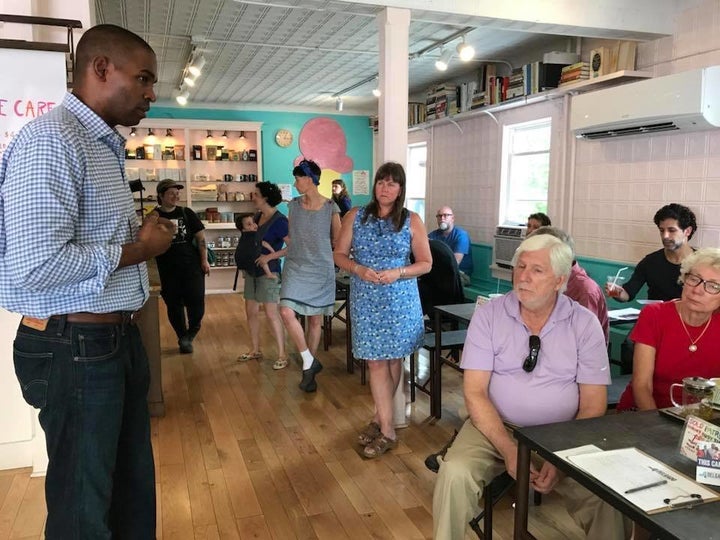 Democrat Antonio Delgado, left, speaks to voters in New Paltz, New York.