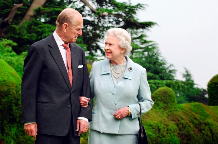 Queen Elizabeth and her late husband, Prince Philip, the Duke of Edinburgh, are seen walking at Broadlands in Romsey, southern England, in this 2007 photograph.