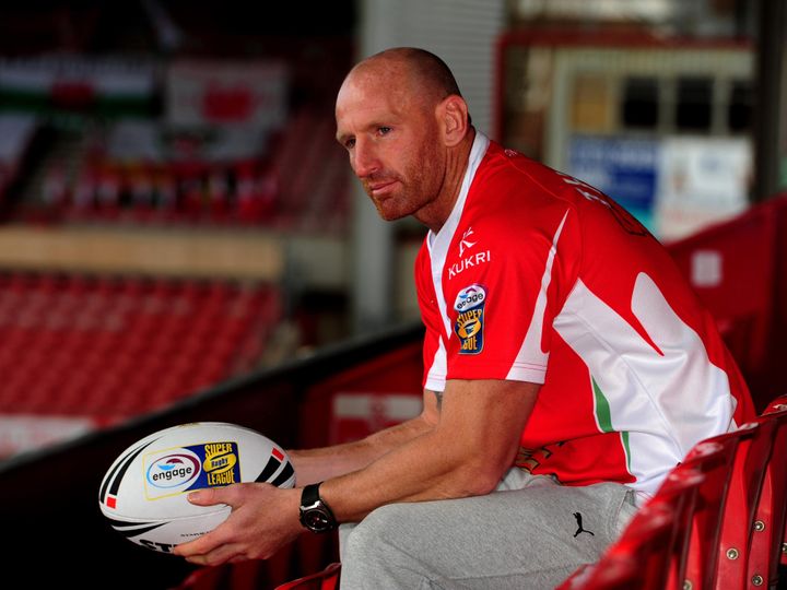 Former Welsh rugby star Gareth Thomas has called for homophobic chanting to be banned at football matches 
