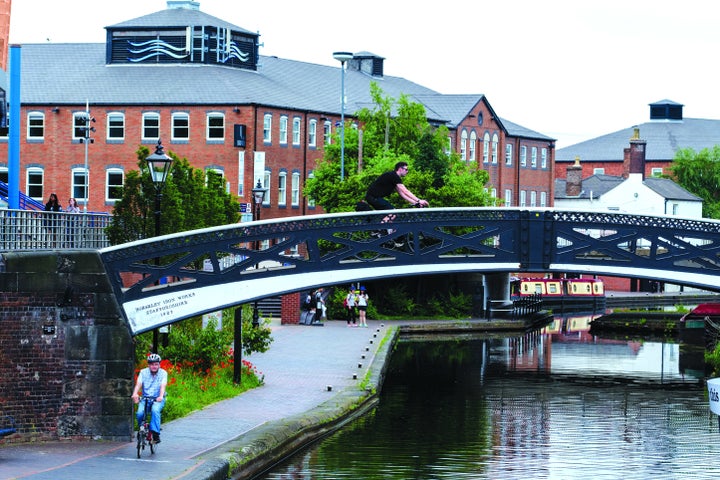 A cyclist by the canals in Birmingham. 