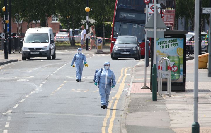 Forensic investigators at the scene in Romford, east London.