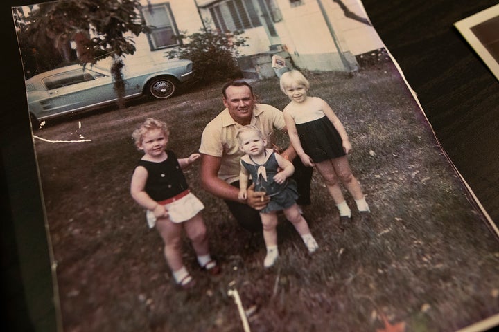 A 1971 family photo shows Christal Collins (left), her father, Bill Collins, and her sisters, Tracy and Marie. 