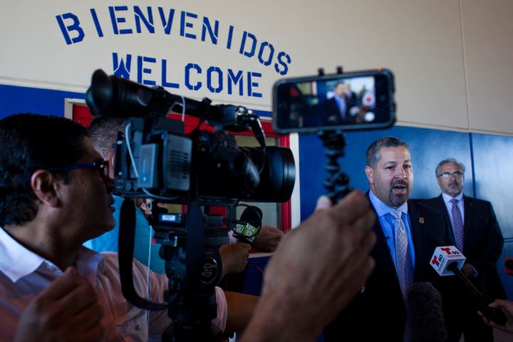 San Antonio Office Director Enrique M. Lucero talks to members of the media at the Karnes County Residential Center, a family immigrant lockup in South Texas, on July 31, 2014.