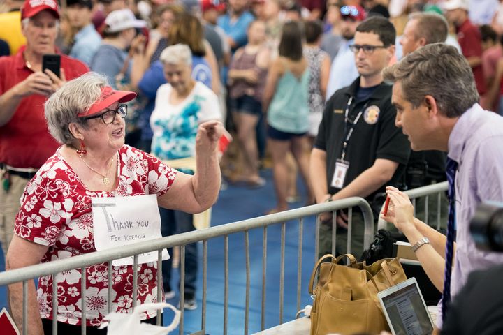 A woman shouted at CNN's Jim Acosta before a rally in South Carolina on Monday.