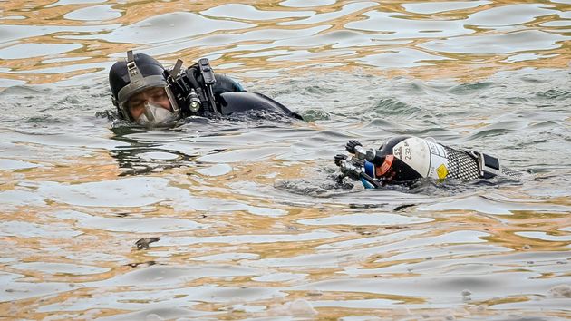 Specialist dive teams and onshore rescue parties are combing the lake as the search continues for a second day