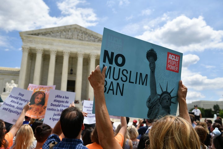 People protest the Muslim travel ban outside of the U.S. Supreme Court in Washington, D.C., on June 26, 2018.