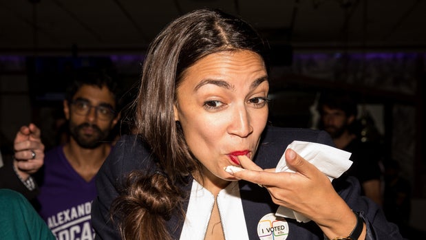 NEW YORK, NY - JUNE 26: Progressive challenger Alexandria Ocasio-Cortez celebrartes with supporters at a victory party in the Bronx after upsetting incumbent Democratic Representative Joseph Crowly on June 26, 2018 in New York City. (Photo by Scott Heins/Getty Images)