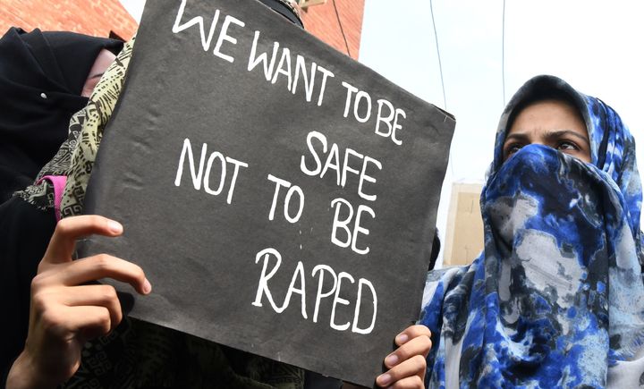 A Kashmiri woman holds up a sign during an April 16 protest calling for justice after the rape and murder of an 8-year-old girl in Jammu and Kashmir, India.