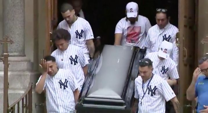 Pallbearers, most wearing matching New York Yankee jerseys, carry the casket at the funeral service on Wednesday for Guzman-Feliz.