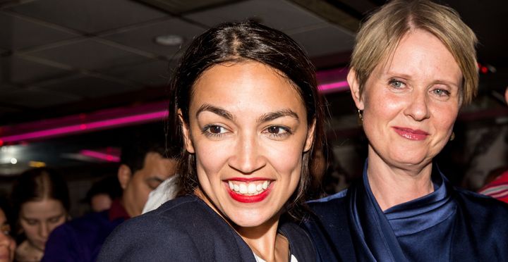 Alexandria Ocasio-Cortez, joined by gubernatorial candidate Cynthia Nixon (right), celebrates her upset victory on June 26.