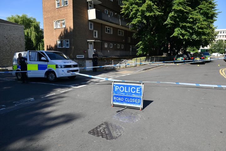 A police cordon on Prewett Street, Bristol, where man died and two men were taken to hospital with life-threatening injuries following reports of an aggravated burglary.