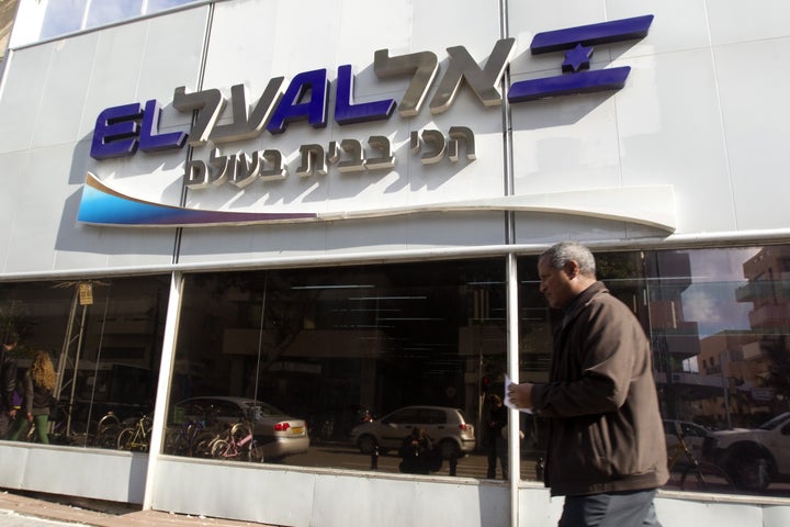 A man walks past an office of the Israeli airline El Al in Tel Aviv on Jan. 16, 2012.