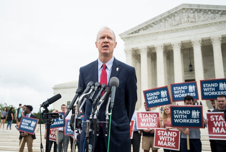 Illinois Gov. Bruce Rauner (R) speaks outside the U.S. Supreme Court after its decision on Wednesday.