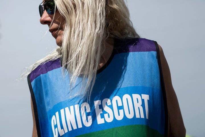 A volunteer waits for patients outside the Jackson Women's Health Organization, the last abortion clinic in Mississippi, on A