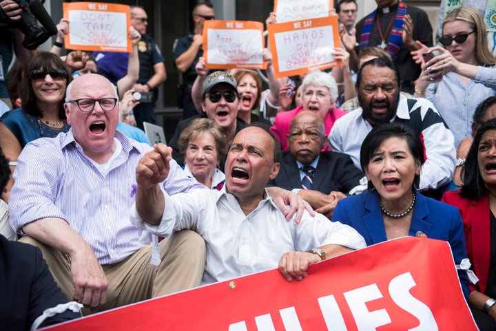 Rep. Joe Crowley (D-N.Y.), left, and other congressional Democrats, participate in a protest in Washington against the Trump administration's family separation policy.