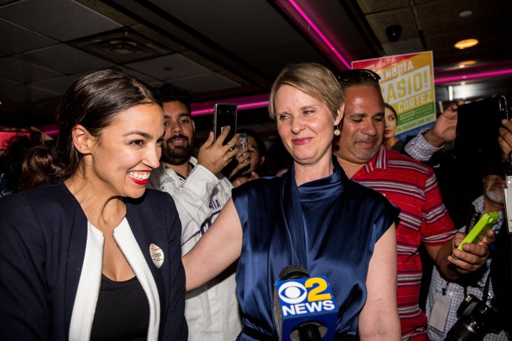 Alexandria Ocasio-Cortez celebrates her surprise victory Tuesday night with New York gubernatorial candidate Cynthia Nixon.