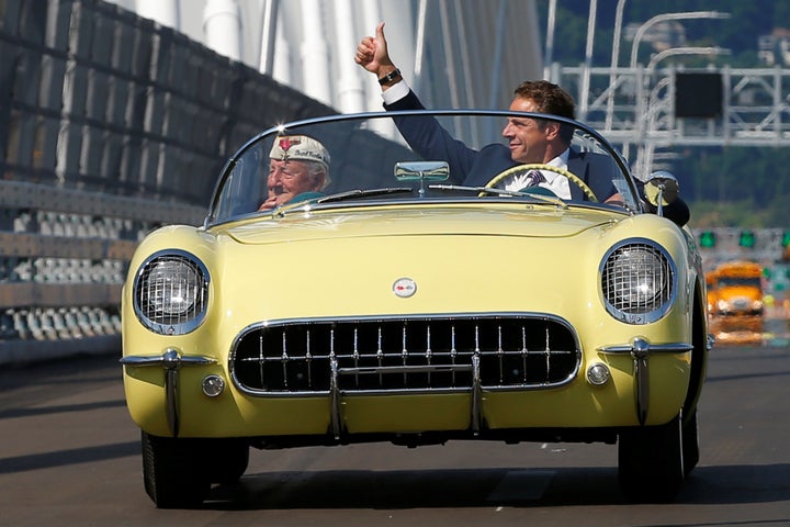 Andrew Cuomo drives a 1955 Chevrolet Corvette with World War II veteran Armando "Chick" Gallela, during a dedication ceremony for the new Governor Mario M. Cuomo Bridge. The structure will replace the current Tappan Zee Bridge over the Hudson River in Tarrytown, New York.