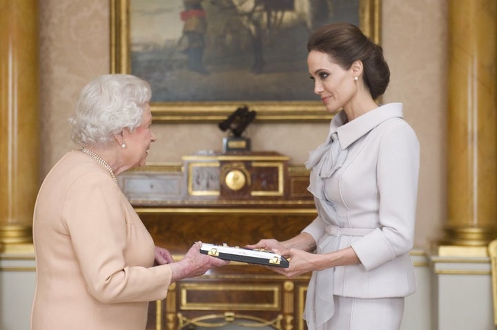 Angelina Jolie wore the cross given to her by the queen in 2014. 