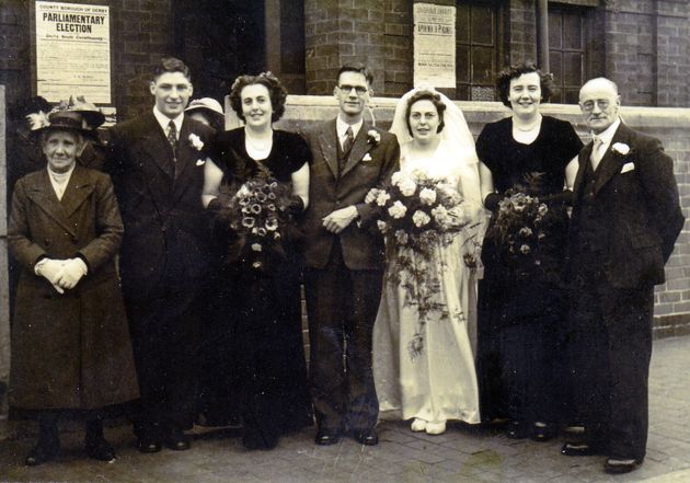 Eric and Edith with friends and family on their wedding day. 