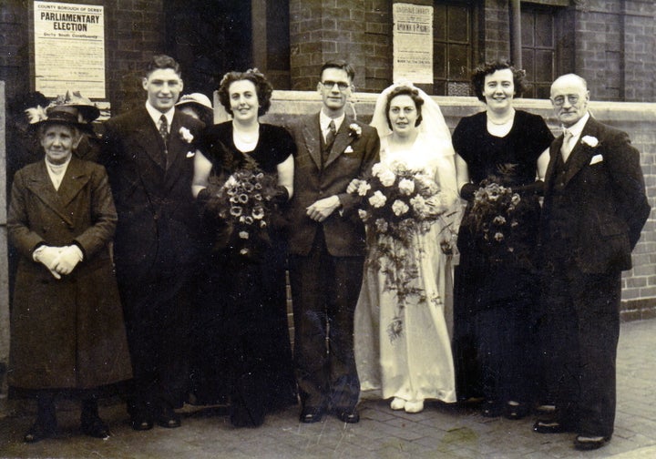 Eric and Edith with friends and family on their wedding day. 