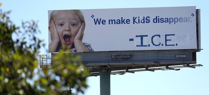 A vandalized billboard in Emeryville, California, shows a message protesting ICE's forcible separation of children from their parents if they're caught trying to enter the U.S. from Mexico.