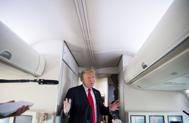 President Donald Trump speaks to the press aboard Air Force One in flight as he travels from Joint Base Andrews in Maryland, to Bedminster, New Jersey, June 29, 2018.